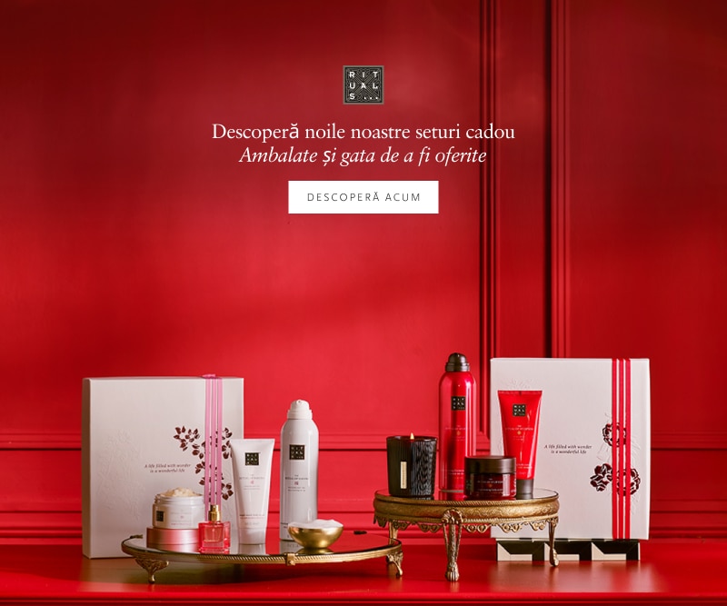 Seturi cadou Rituals – produse cosmetice premium ambalate elegant, pe fundal roșu, ideale pentru oferit